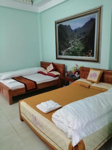 Ένα ή περισσότερα κρεβάτια σε δωμάτιο στο Thien An Guest House