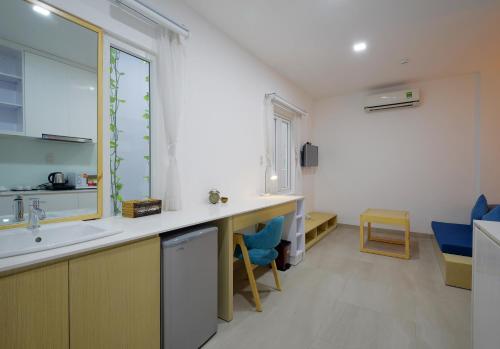 a kitchen with a sink and a counter top at Babylon D3 Serviced Apartment in Ho Chi Minh City