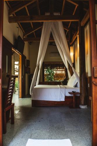 Ένα ή περισσότερα κρεβάτια σε δωμάτιο στο The Trang Villas