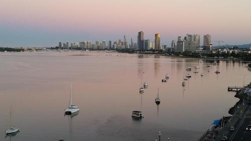 a large body of water with boats and a city at Beaconlea in Gold Coast