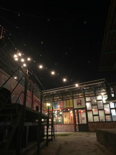 a building with lights on it at night at THE WOOD BOUTIQUE HOTEL in Muar
