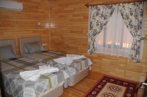 A bed or beds in a room at Merhaba Hotel