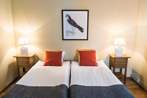 Säng eller sängar i ett rum på Nordens Ark Hotell