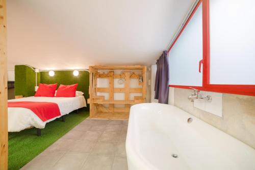 Katil atau katil-katil dalam bilik di Tomate Rooms