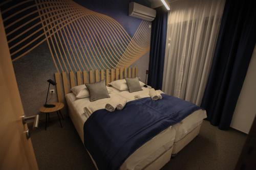 Ένα ή περισσότερα κρεβάτια σε δωμάτιο στο Luxury Apartments Taša