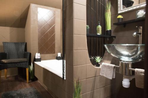 a bathroom with a sink and a mirror at Glamour in Budapest