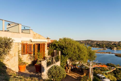 a house with a view of a river at Molarotto in Porto Taverna