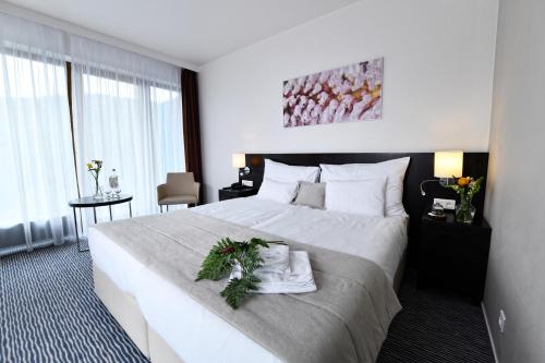 Postel nebo postele na pokoji v ubytování Wellness Hotel Vista