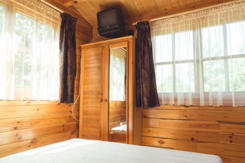 Vuode tai vuoteita majoituspaikassa Pušynėlis