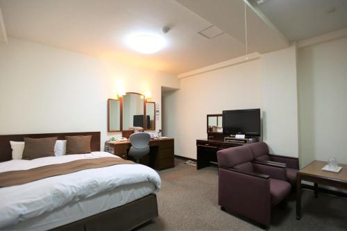 Postel nebo postele na pokoji v ubytování Hotel Yokosuka