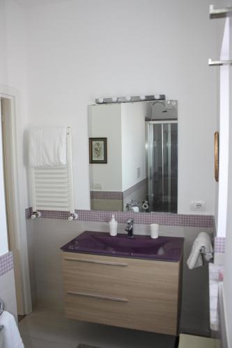 a bathroom with a sink and a mirror at Casa Bice Amazing view of Vesuvius in Sorrento