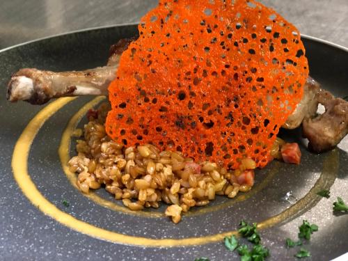 a plate of food with a pile of food at Logis des Sittelles in Montfort-le-Gesnois