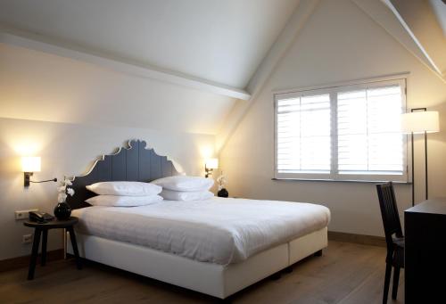 Llit o llits en una habitació de Fletcher Hotel - Restaurant Nautisch Kwartier