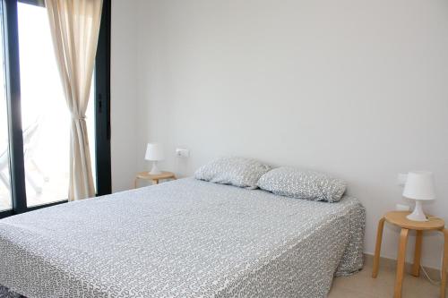 Giường trong phòng chung tại Ático Avda del Mar Inmomart