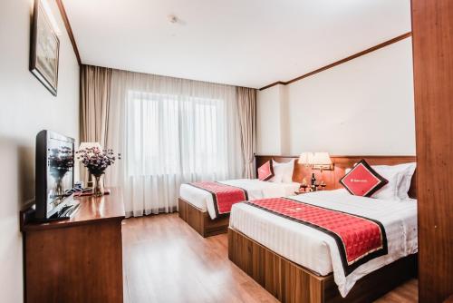 Cama o camas de una habitación en HANZ Sunny 2 Hotel Hanoi