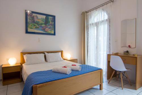 Posteľ alebo postele v izbe v ubytovaní Natsios Apartments