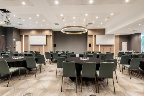 a conference room with a large table and chairs at Edgbaston Park Hotel Birmingham in Birmingham