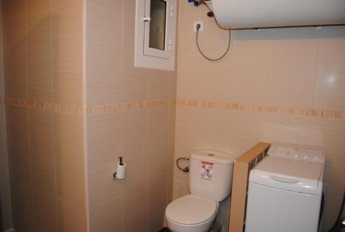 a small bathroom with a toilet and a sink at Legroux - 373 in Llafranc