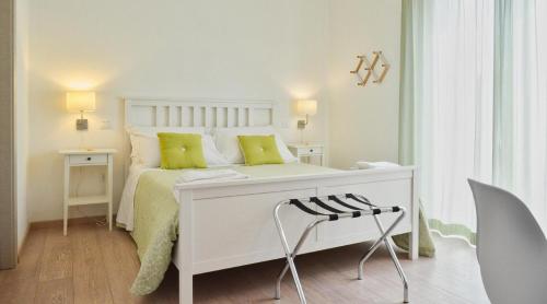Postel nebo postele na pokoji v ubytování Petit Hotel