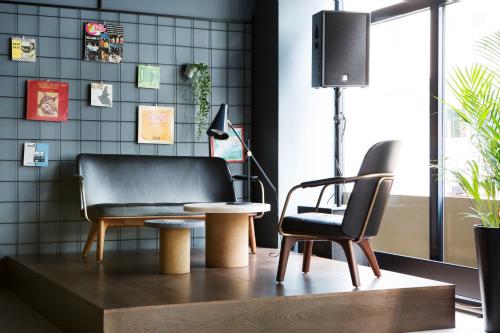 a living room with a chair and a table at Comfort Hotel Bergen in Bergen