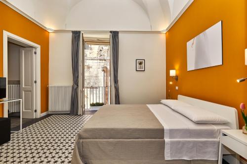 a hotel room with a bed and a window at Donna Teresa Guest House in Lecce