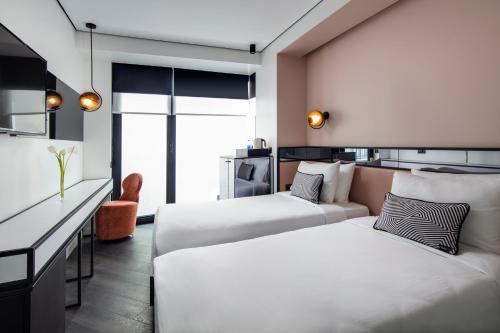 a hotel room with two beds and a kitchen at The Westist Hotel & Spa - Special Category in Istanbul