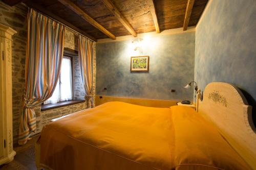 Albergo Cà Cerfogliにあるベッド