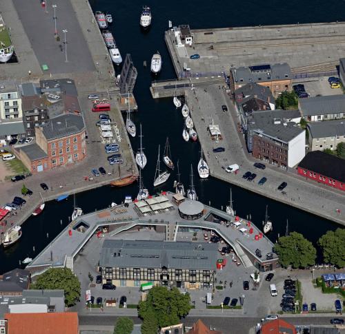 an aerial view of a marina with boats in the water at Hotel Kontorhaus Stralsund in Stralsund