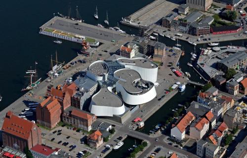 an aerial view of a building in a harbor at Hotel Kontorhaus Stralsund in Stralsund