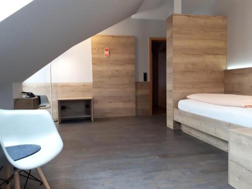 Postel nebo postele na pokoji v ubytování Hotel Bigger Hof - Wirtshaus Platzhirsch am Jahnplatz
