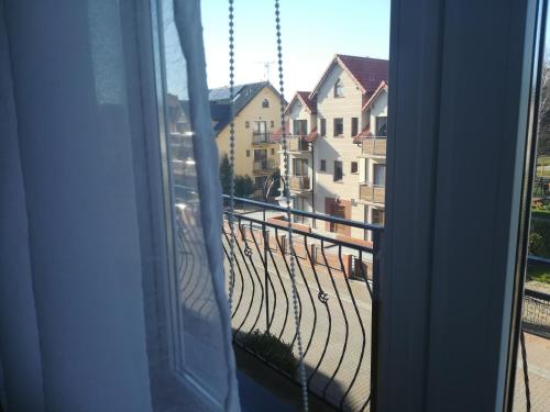 a view of a balcony from a window at Prawdziwe Wczasy in Mrzeżyno