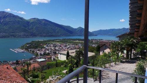 a view of a town and a body of water at Case di Sotto, House & Breakfast in Locarno