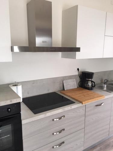 a kitchen with a sink and a stove top oven at Villa Brusadela Suites Garda in Garda