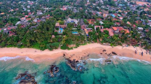 an aerial view of a house on a beach at R Degrees in Ambalangoda