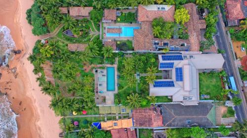 an aerial view of a beach with solar panels at R Degrees Boutique Hotel & Spa in Ambalangoda