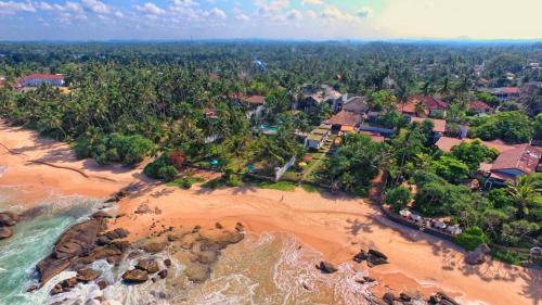 an aerial view of a beach with a resort at R Degrees Boutique Hotel & Spa in Ambalangoda
