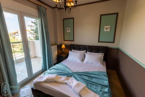 Ένα ή περισσότερα κρεβάτια σε δωμάτιο στο Irene Suites
