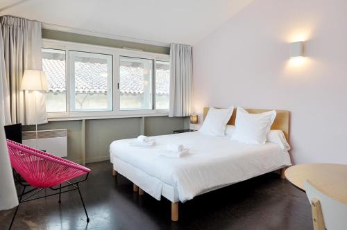 En eller flere senge i et værelse på Temporesidence Chateauneuf
