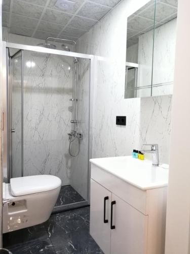 Koupelna v ubytování White Golden Suite Hotel