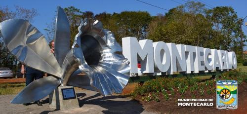 a large metal sign with a monument in front of it at Cabañas Nativa in Montecarlo