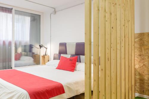 Katil atau katil-katil dalam bilik di Tomate Rooms
