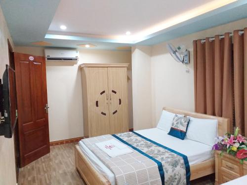 Ένα ή περισσότερα κρεβάτια σε δωμάτιο στο Thanh Trung Hotel