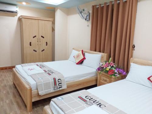 Ένα ή περισσότερα κρεβάτια σε δωμάτιο στο Thanh Trung Hotel