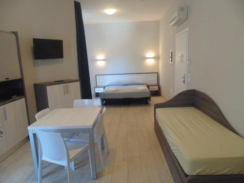 Ένα ή περισσότερα κρεβάτια σε δωμάτιο στο Residence Conchiglie