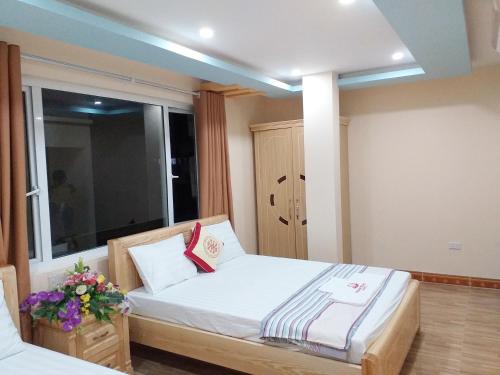 Ένα ή περισσότερα κρεβάτια σε δωμάτιο στο Thanh Trung Hotel
