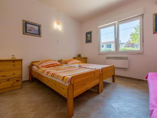Postel nebo postele na pokoji v ubytování Apartments Ksenija
