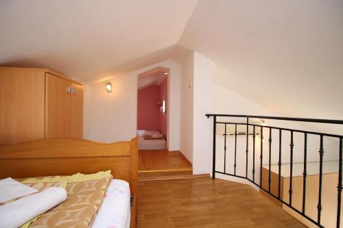 Posteľ alebo postele v izbe v ubytovaní Apartments IVONA 6