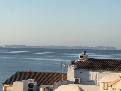 a view of the ocean from the roofs of buildings at Ca Na Clar in Sa Ràpita
