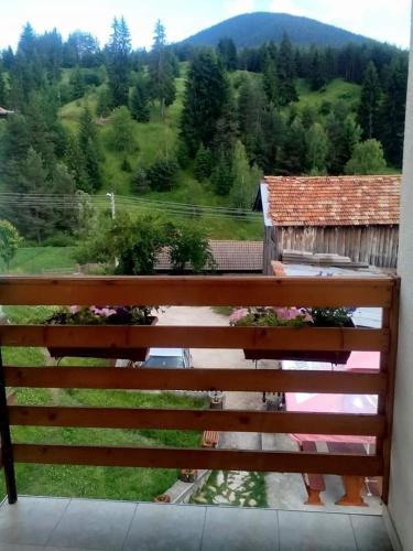 a view from a balcony of a house with a fence at вила Здравец in Yagodina