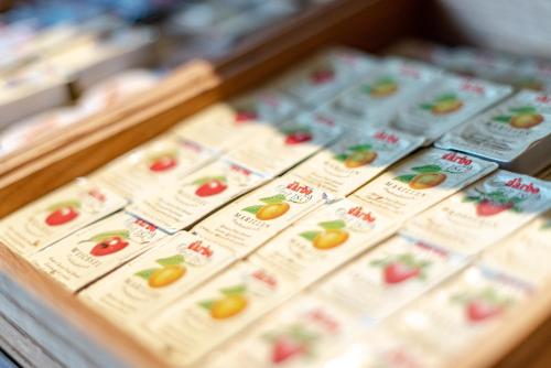 a display case in a grocery store filled with food at BinderS Budget City-Mountain Hotel in Innsbruck